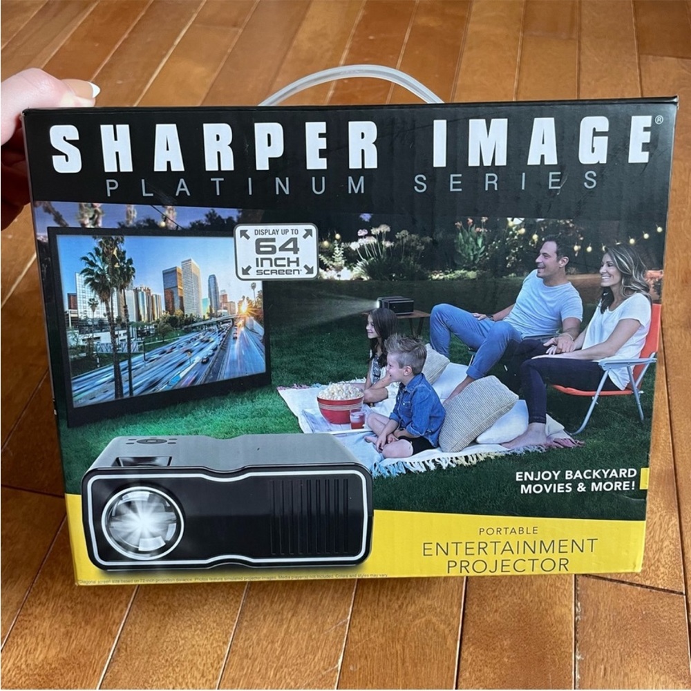 sharper image movie projector! NEW!